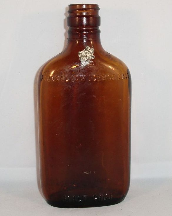 This listing is for a 1920s prohibition liquor bottle. The bottle is 