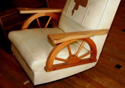 RANCH OAK WAGON WHEEL ROCKER/Saddle Decor.has two inch tear to 