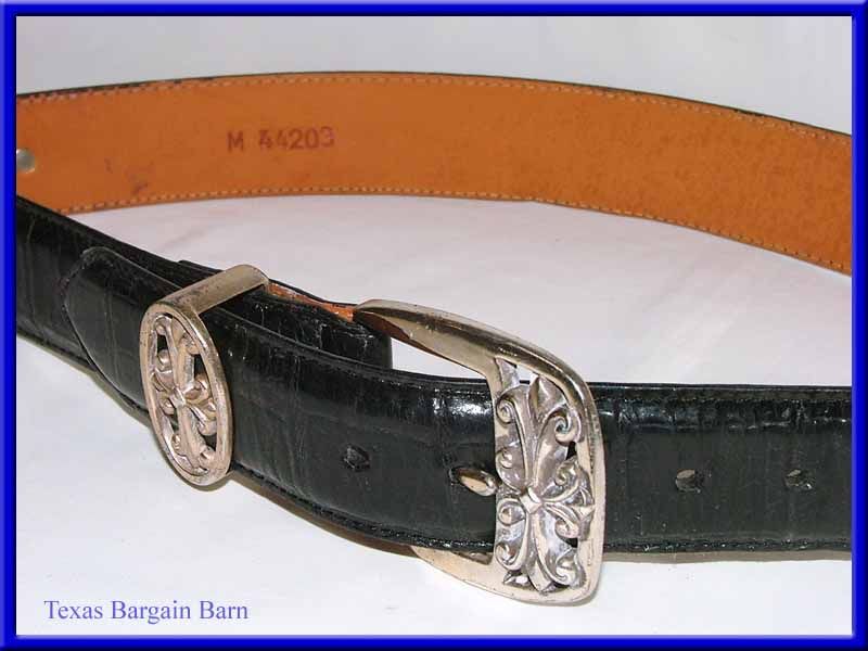  Belt is in pre owned condition, with leather wear and quite a bit 