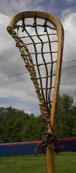 This is a vintage wooden lacrosse stick. Measures 38 long. Signed on 