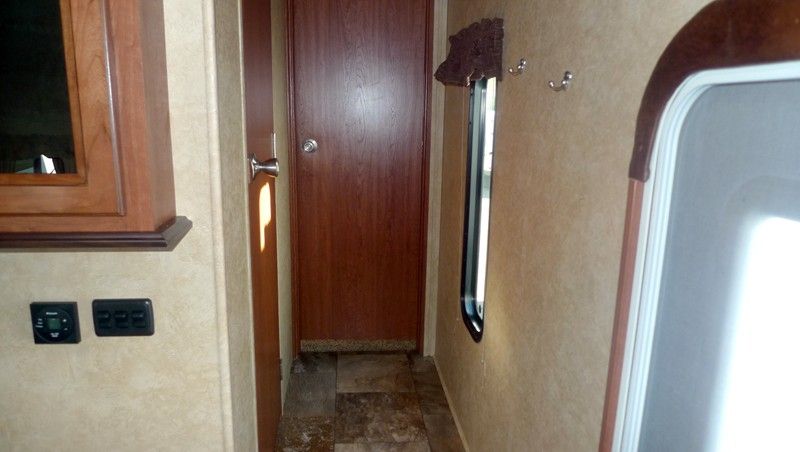 Bathroom with 2 solid entry doors, and large corner glass shower